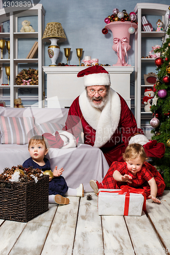 Image of The two little girls with Santa at studio with christmas decorations