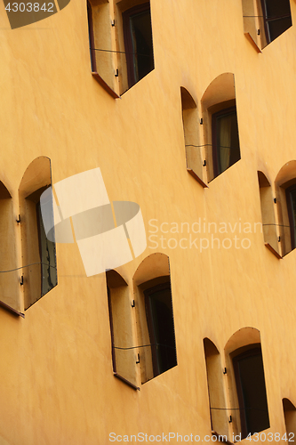 Image of open mirror shutters on the sunlit wall of the house, Stockholm