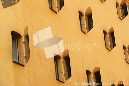 Image of open mirror shutters on the sunlit wall of the house, Stockholm