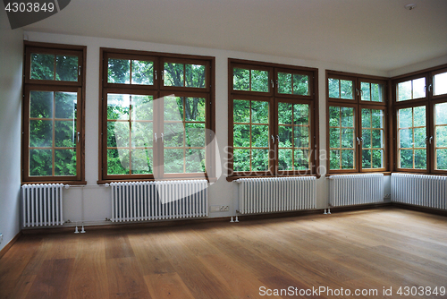 Image of empty room with large windows