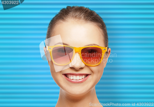 Image of happy teenage girl or woman face in shades