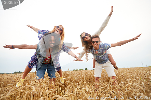 Image of happy hippie friends having fun on cereal field