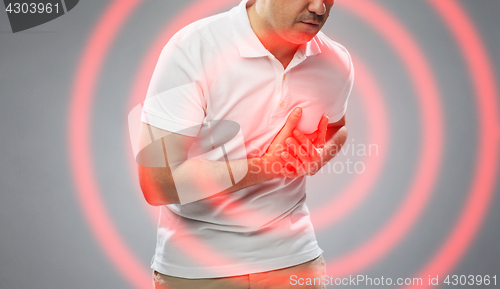 Image of close up of man suffering from heart ache