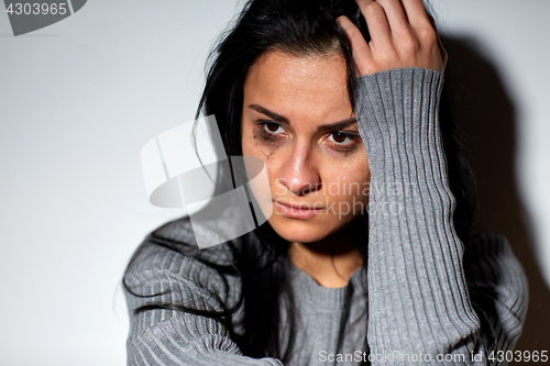 Image of close up of unhappy crying woman