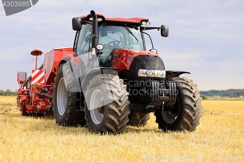 Image of Red Case IH Tractor and Seeder on Stubble Field