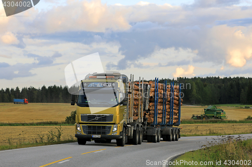 Image of Volvo FH Logging Truck on Evening Country Road