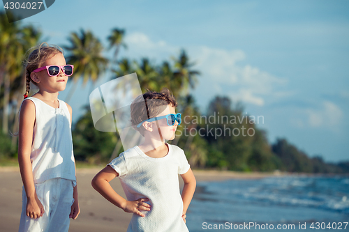 Image of Happy children playing on the beach at the day time.