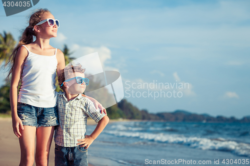 Image of Happy children playing on the beach at the day time.