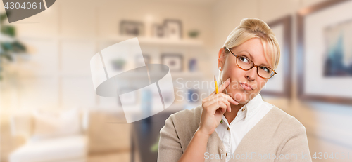 Image of Beautiful Expressive Student or Businesswoman with Pencil in Off