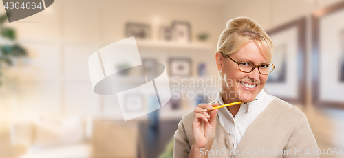 Image of Beautiful Expressive Student or Businesswoman with Pencil in Off