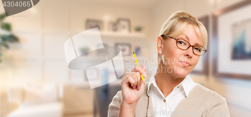 Image of Beautiful Expressive Student or Businesswoman with Pencil in Off