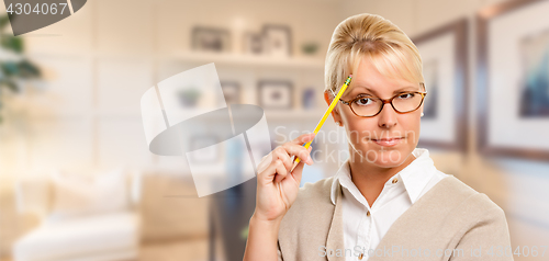 Image of Beautiful Expressive Student or Businesswoman with Pencil in Off