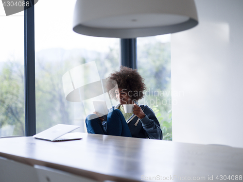 Image of young African American woman in the living room