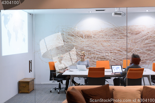 Image of Startup Business Team At A Meeting at modern night office buildi
