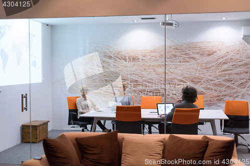 Image of Startup Business Team At A Meeting at modern night office buildi