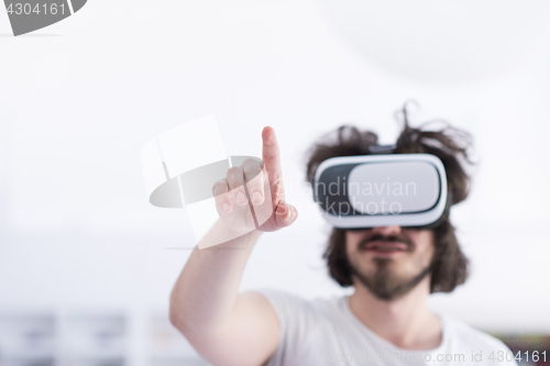 Image of man using VR-headset glasses of virtual reality