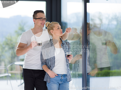 Image of young couple enjoying morning coffee