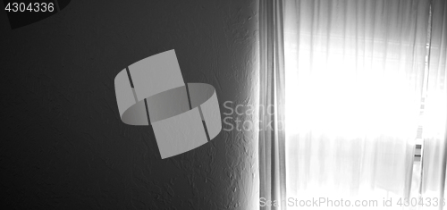 Image of dark wall with bright window light