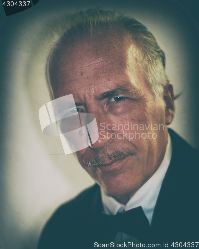 Image of older man with mustache vintage color