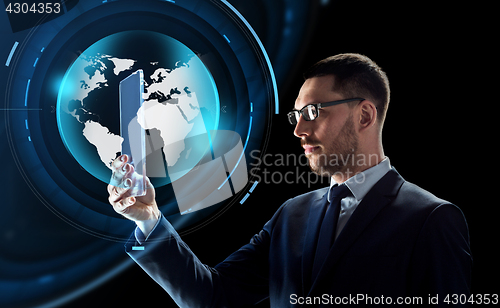 Image of businessman with tablet pc and virtual globe