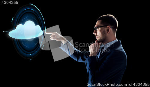 Image of businessman over black with cloud projection