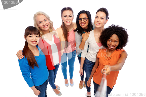 Image of international group of women with selfie stick