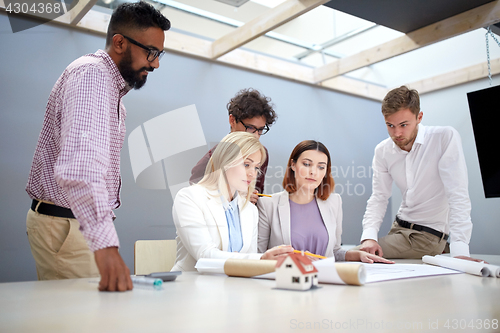 Image of business team discussing house project at office