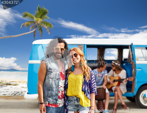 Image of happy hippie couples and minivan on beach