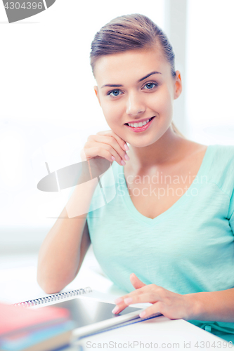 Image of smiling student girl with tablet pc