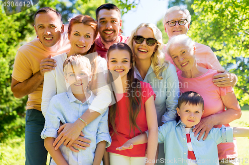 Image of happy family portrait in summer garden