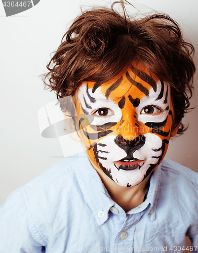 Image of little cute boy with faceart on birthday party close up, little 