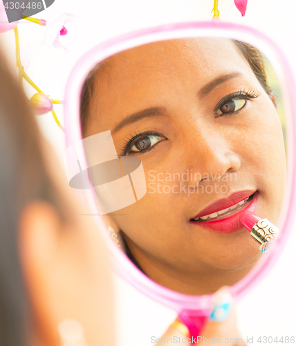 Image of Applying Lipstick In Mirror Shows Beauty And Makeup