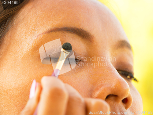 Image of Eyeshadow Eye Brush Application Shows Eyes Makeup