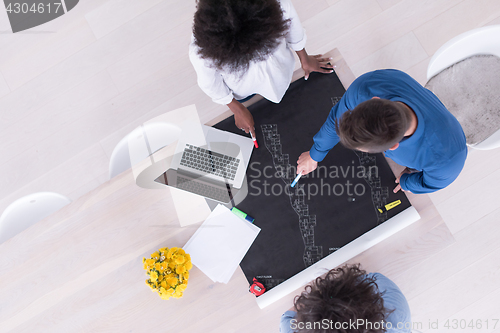 Image of top view of Multiethnic startup business team on meeting