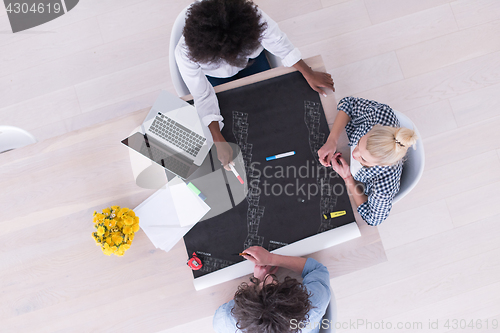 Image of top view of Multiethnic startup business team on meeting