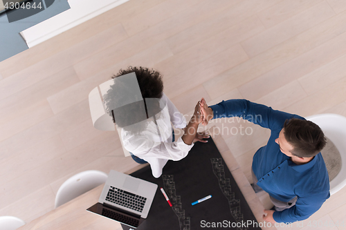 Image of top view of Multiethnic startup business team on meeting