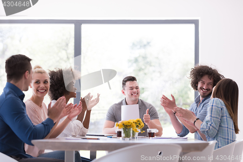 Image of multiethnic startup Group of young business people celebrating s