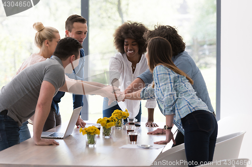 Image of multiethnic startup Group of young business people celebrating s