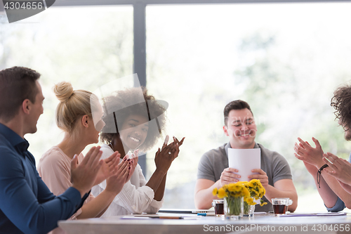 Image of multiethnic startup Group of young business people celebrating s