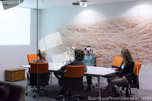 Image of startup business team using virtual reality headset