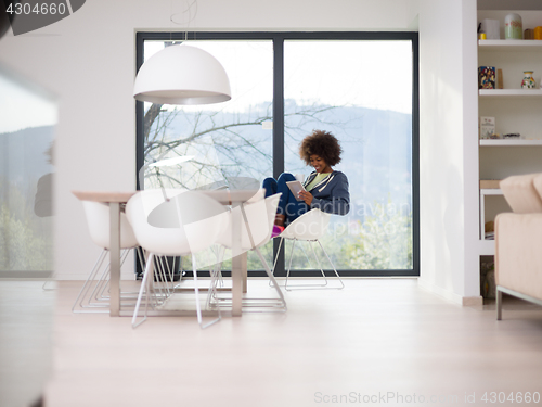 Image of young African American woman in the living room