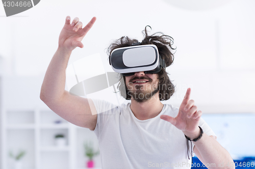 Image of man using VR-headset glasses of virtual reality