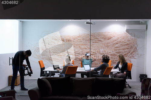 Image of startup business team using virtual reality headset