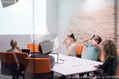 Image of startup business team using virtual reality headset