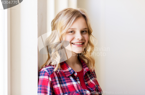 Image of portrait of smiling young woman or teenage girl