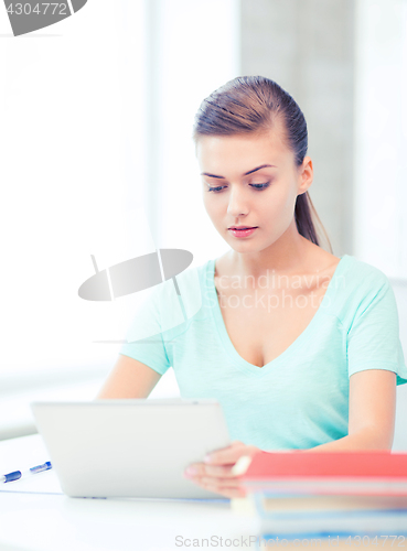 Image of smiling student girl with tablet pc