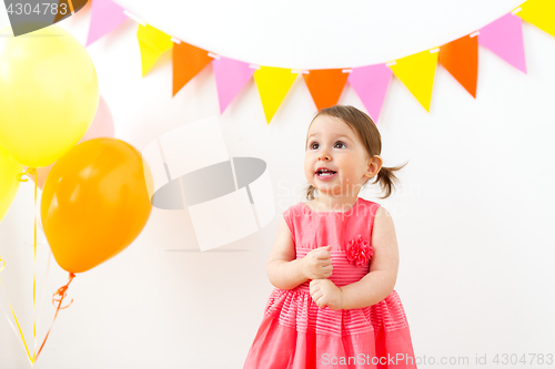 Image of happy baby girl on birthday party