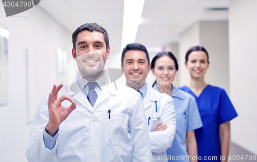 Image of group of happy medics or doctors at hospital