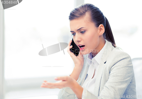 Image of woman shouting into smartphone