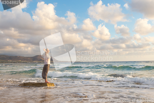 Image of Free Happy Woman Enjoying Sunset on Sandy Beach